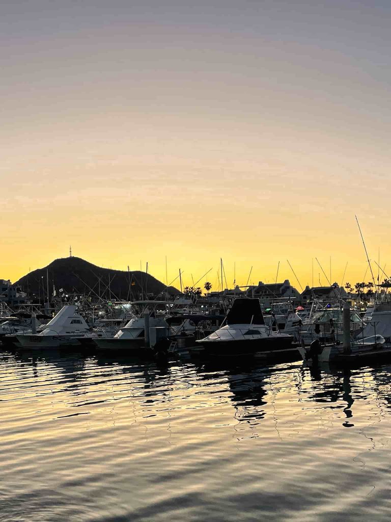 The sunset colours appear in Cabo San Lucas reflecting in the water